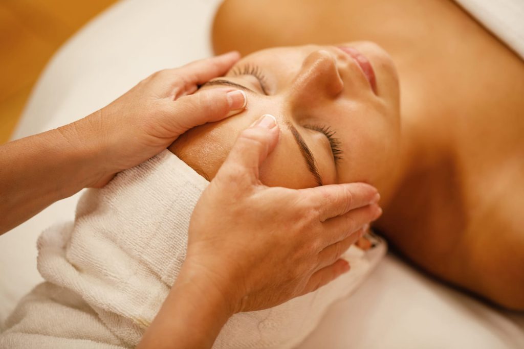 Woman enjoying a gentle head and face massage