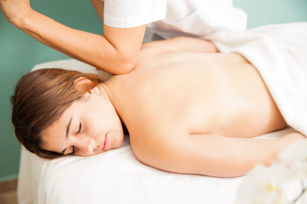 Relaxed woman lying on a massage table during a back massage
